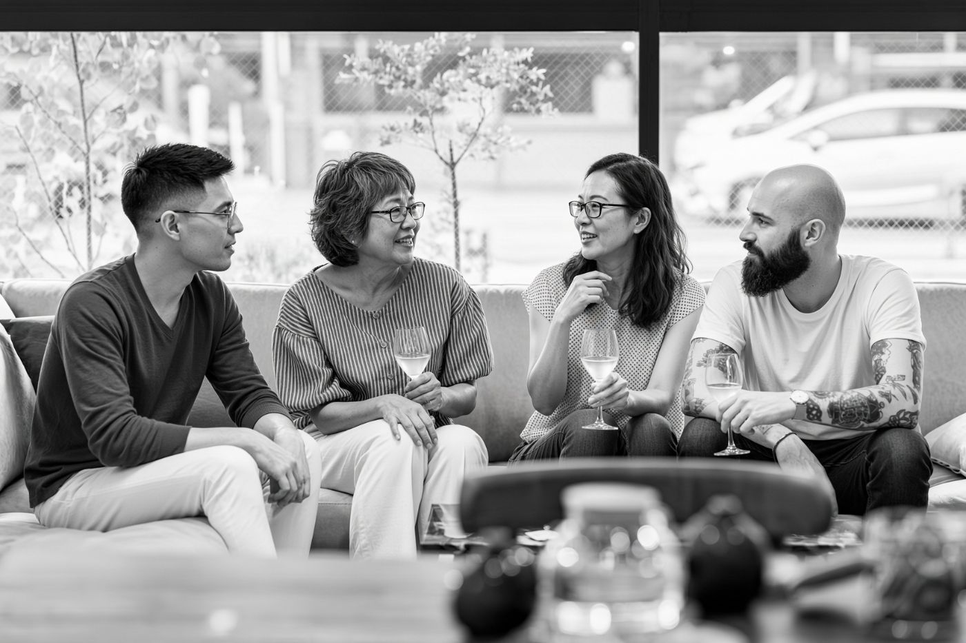 Four friends talking on a sofa